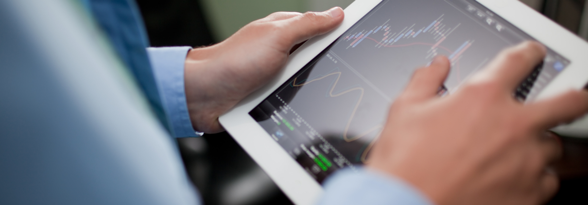 Businessman,Checking,Stock,Market,On,Tablet